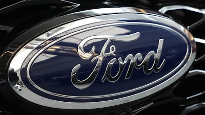 The Ford logo is seen on the grill of a Ford Explorer on display at the Pittsburgh International Auto Show in Pittsburgh, on Feb. 15, 2024.