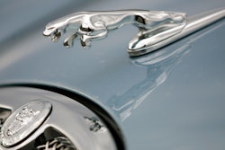 The hood ornament and a portion of the grill of a Jaguar automobile is shown at a dealership in Norwood, Mass. on March 26, 2008.