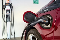 An electric vehicle is charged at a parking garage in Los Angeles, Oct. 17, 2018.