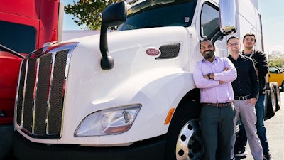 Mechanical and Aerospace Engineering Professor Subith Vasu and students pose with a PACCAR truck that may stand to benefit from Vasu’s hydrogen combustion engine research.