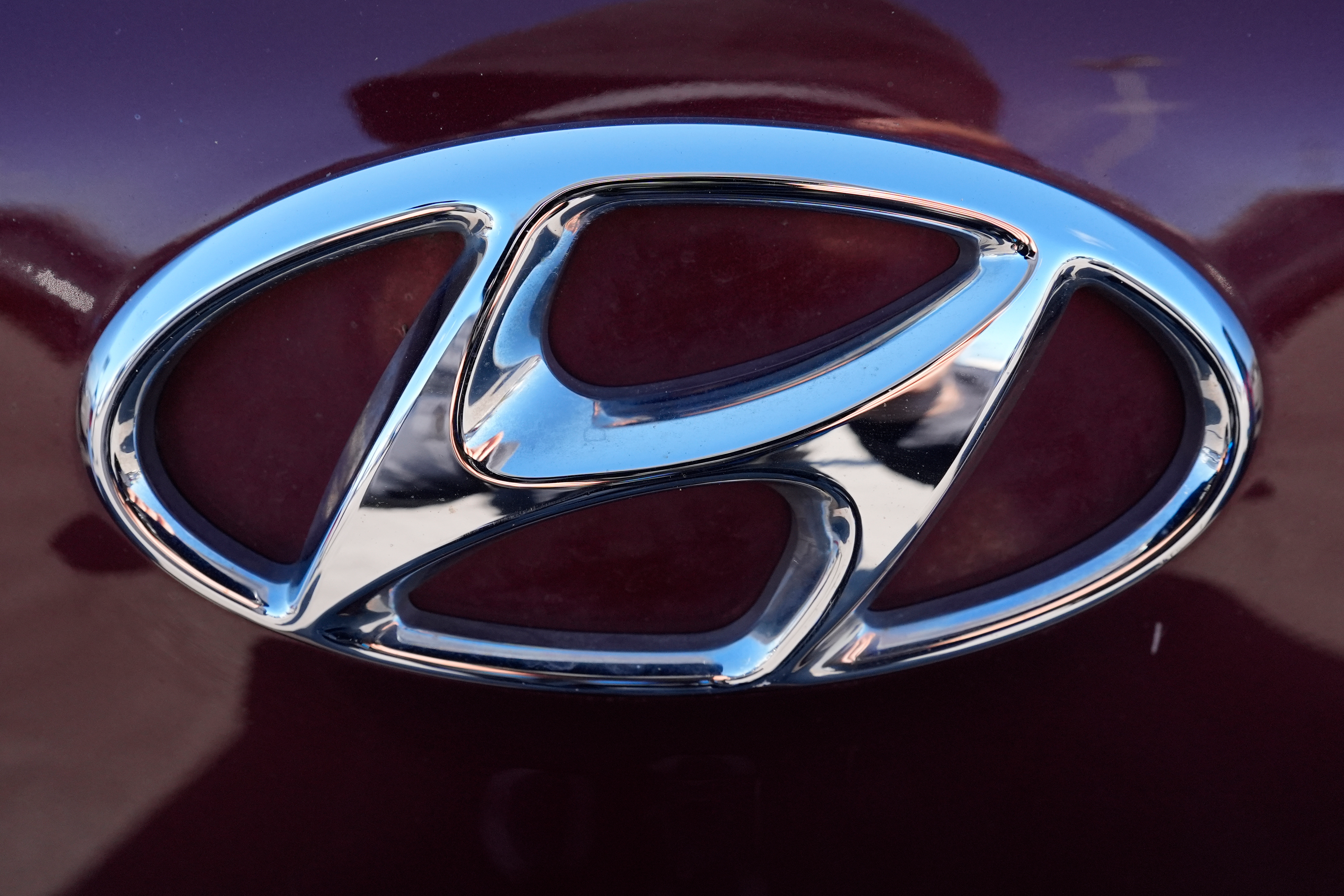 The Hyundai logo is seen at a new and used vehicles dealership in Palatine, Ill., March 20, 2024.
