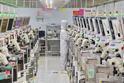 A man works at a manufacturer of Integrated Chip encapsulation in Nantong in eastern China's Jiangsu province on Friday, Sept. 16, 2022.