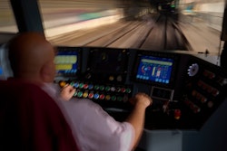 A subway driver operates the train's brake lever before entering a station in Barcelona, Spain, Monday, Dec. 2, 2024.