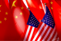 American flags are displayed with Chinese flags on top of a trishaw on Sept. 16, 2018, in Beijing.