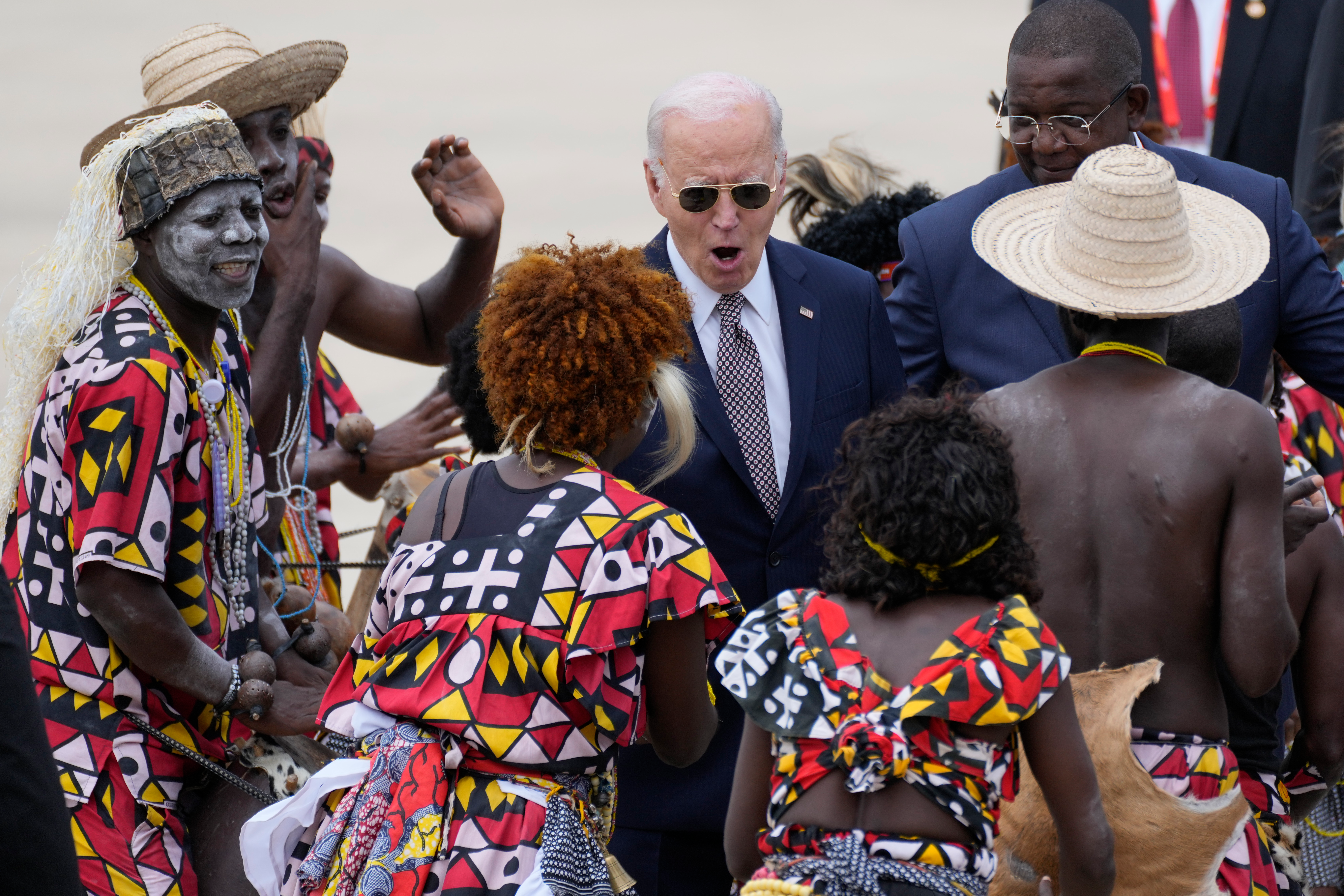 President Joe Biden watches a traditional dance after arriving at Catumbela airport in Angola on Wednesday, Dec. 4, 2024.