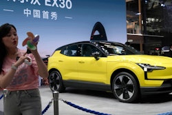 A live streamer works near the Volvo EX30 fully electric small SUV unveiled during Auto China 2024 in Beijing, Thursday, April 25, 2024.