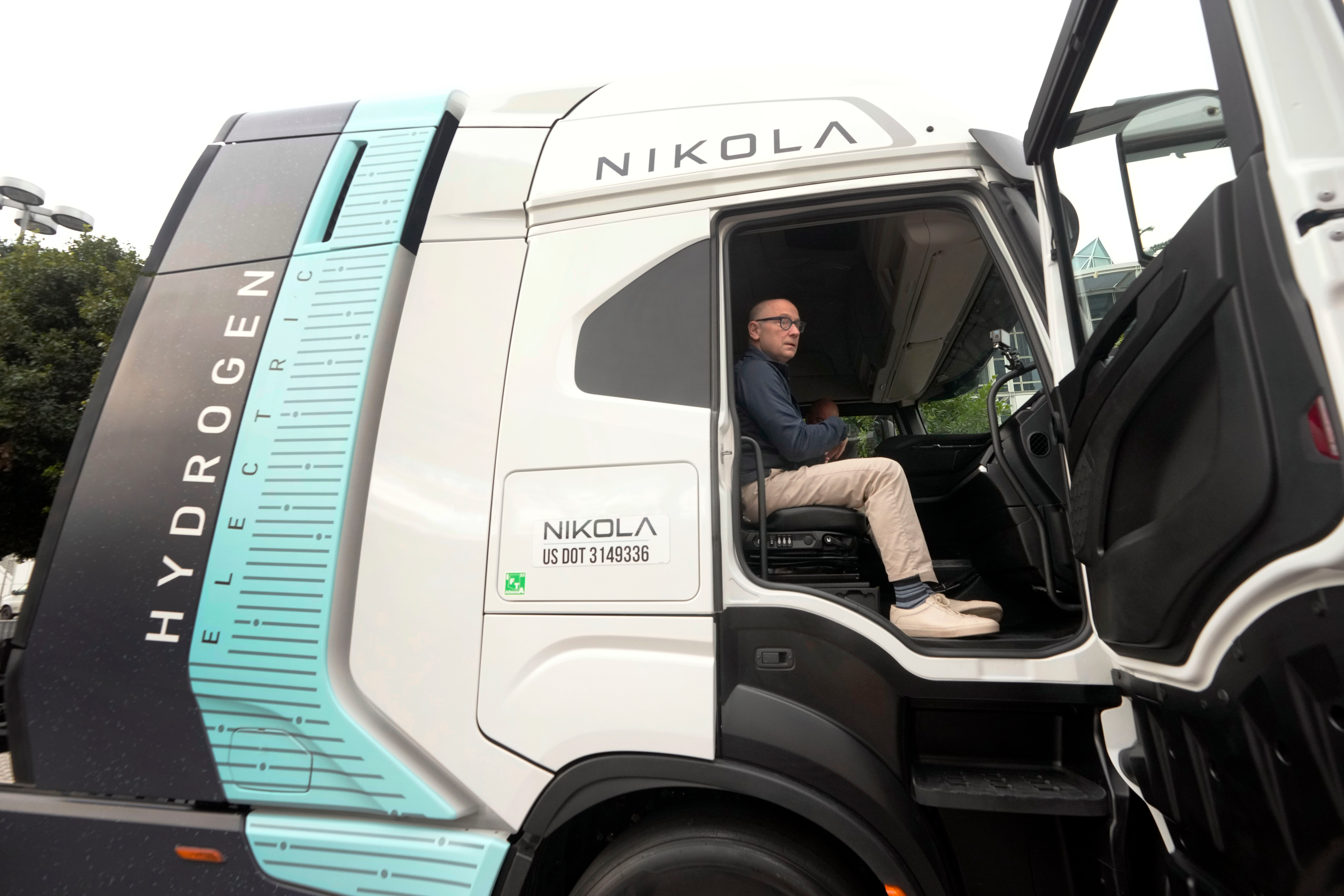 Stephen Girsky, CEO of Nikola Corp., sits in one of the company's electric and hydrogen-powered trucks during the LA Auto Show, Thursday, Nov. 16, 2023, in Los Angeles.