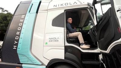 Stephen Girsky, CEO of Nikola Corp., sits in one of the company's electric and hydrogen-powered trucks during the LA Auto Show, Thursday, Nov. 16, 2023, in Los Angeles.