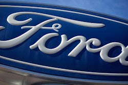 The Ford company logo is seen, Oct. 24, 2021, on a sign at a Ford dealership in southeast Denver.