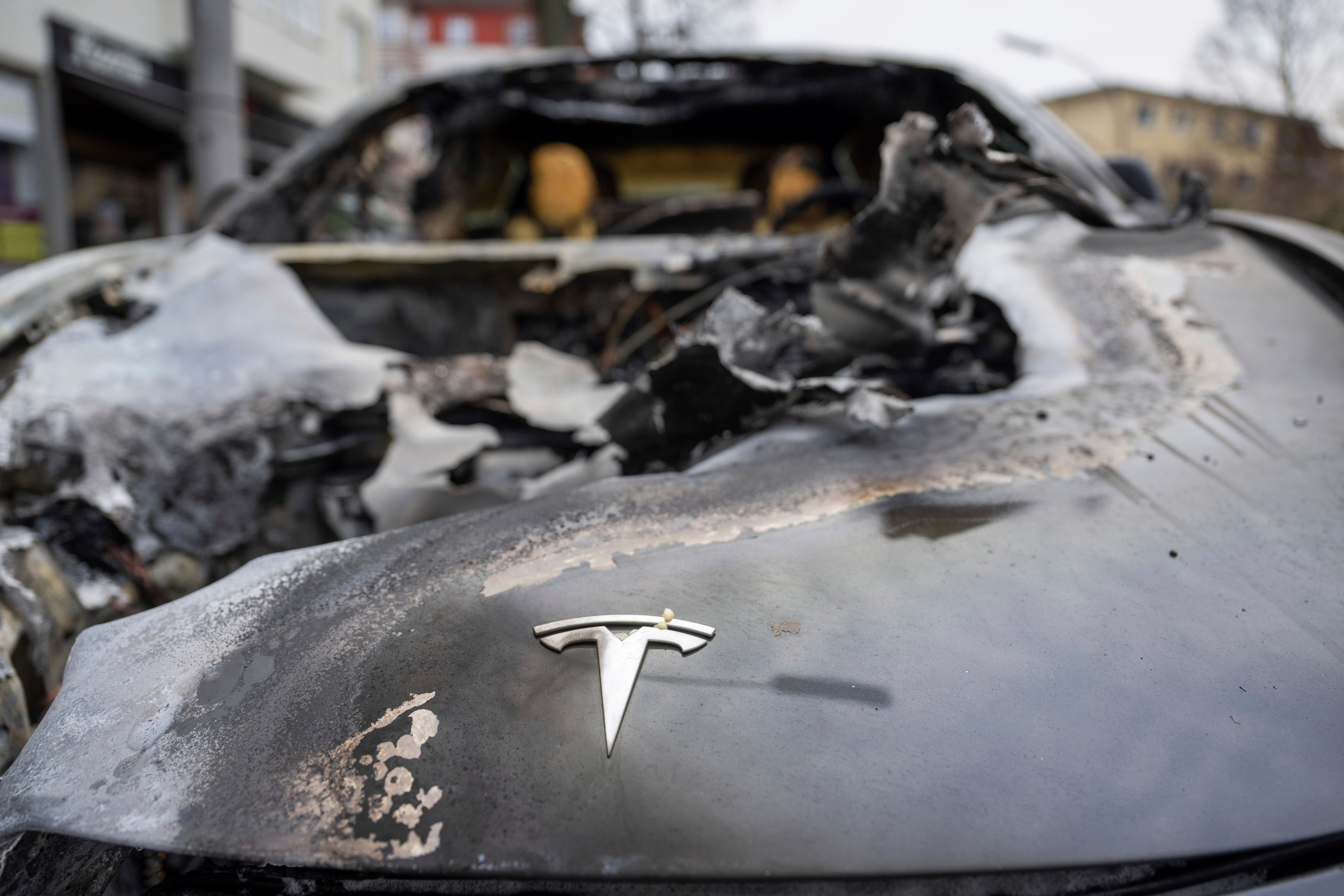 A burnt-out Tesla car stands in the Steglitz district of Berlin, Friday, March 14, 2025, as four Teslas are suspected to have been set on fire in Berlin last night.