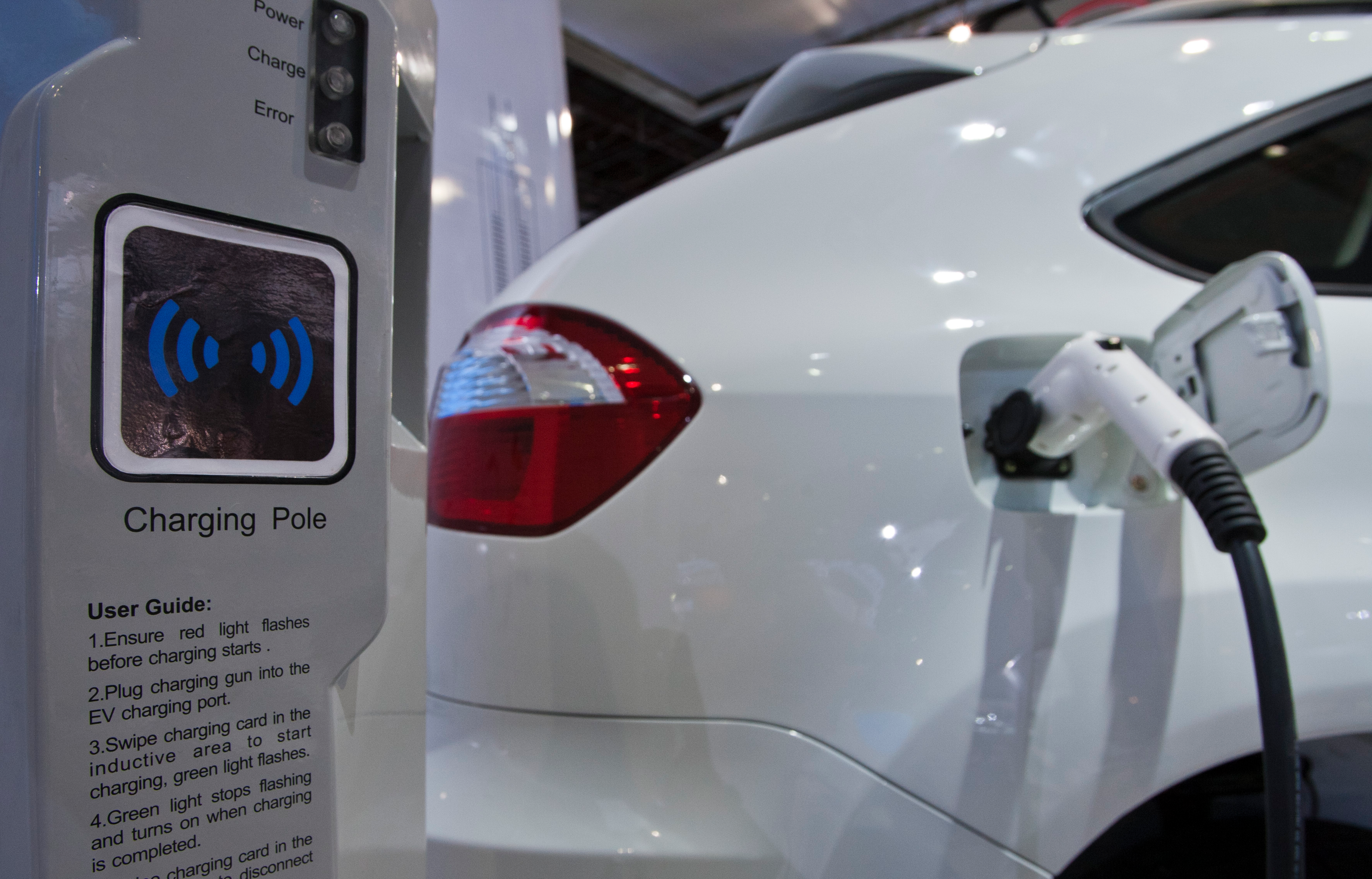 A display shows how the dual-mode electric S6DM sport utility vehicle from Chinese automaker BYD can be plugged into a charging station to recharge its onboard batteries, at the North American International Auto Show on Monday, Jan. 10, 2011, in Detroit.