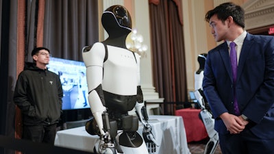 A Tesla robot is displayed as U.S. robotics companies look for congressional support to compete with Chinese companies, on Capitol Hill in Washington, Wednesday, March 26, 2025.