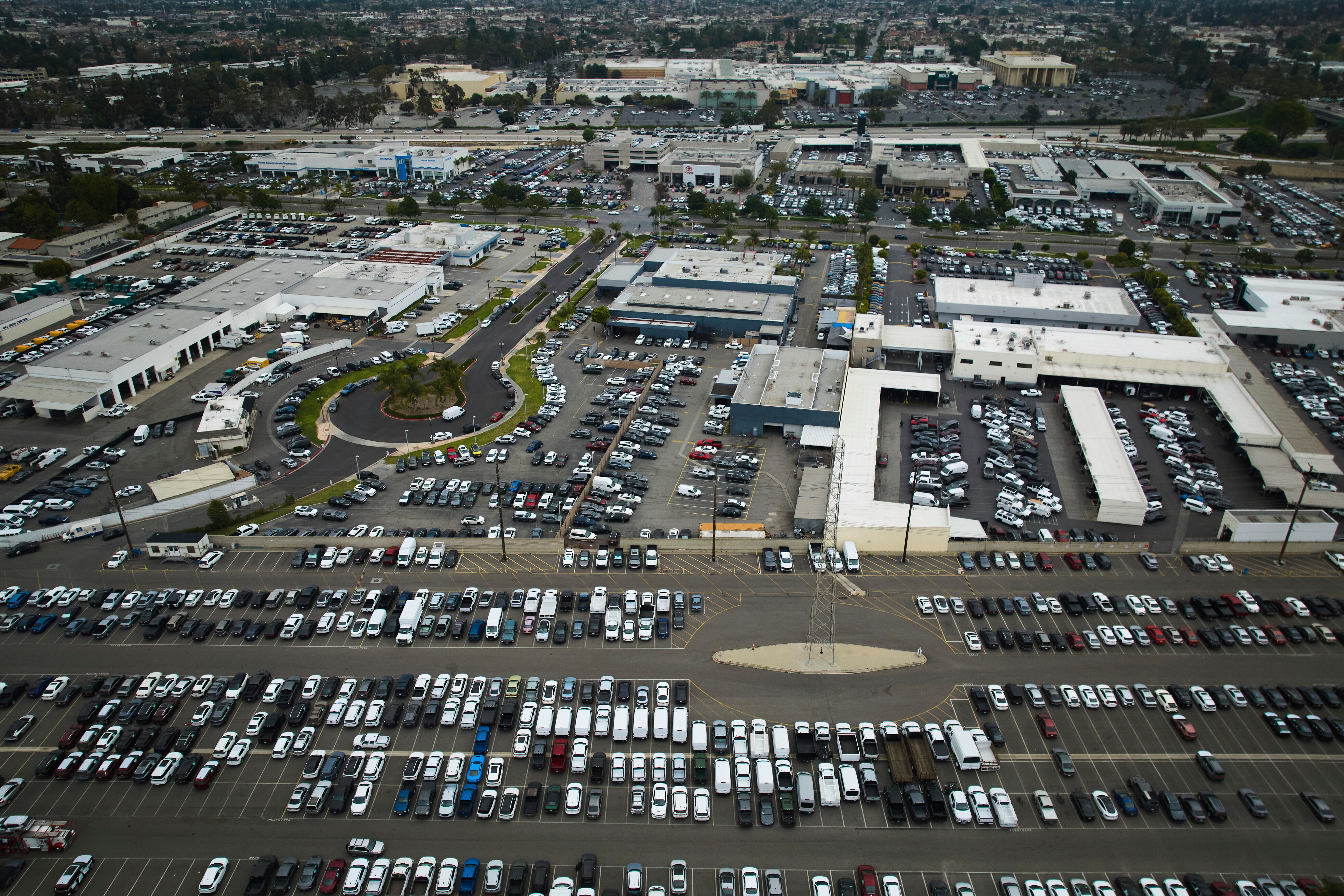 An aerial view shows auto dealerships in Cerritos, Calif., Thursday, March 27, 2025.