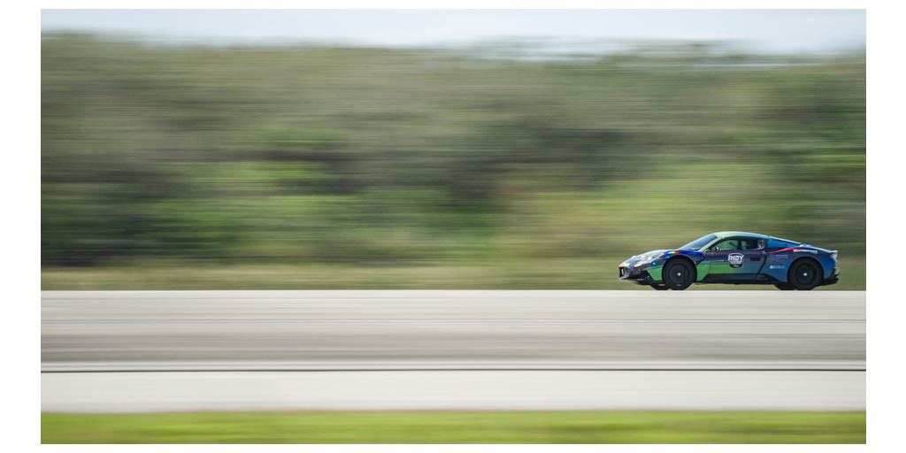 Indy Autonomous Challenge Maserati MC20 with AI-Driver from Politecnico di Milano setting the autonomous land speed record at the Kennedy Space Center.
