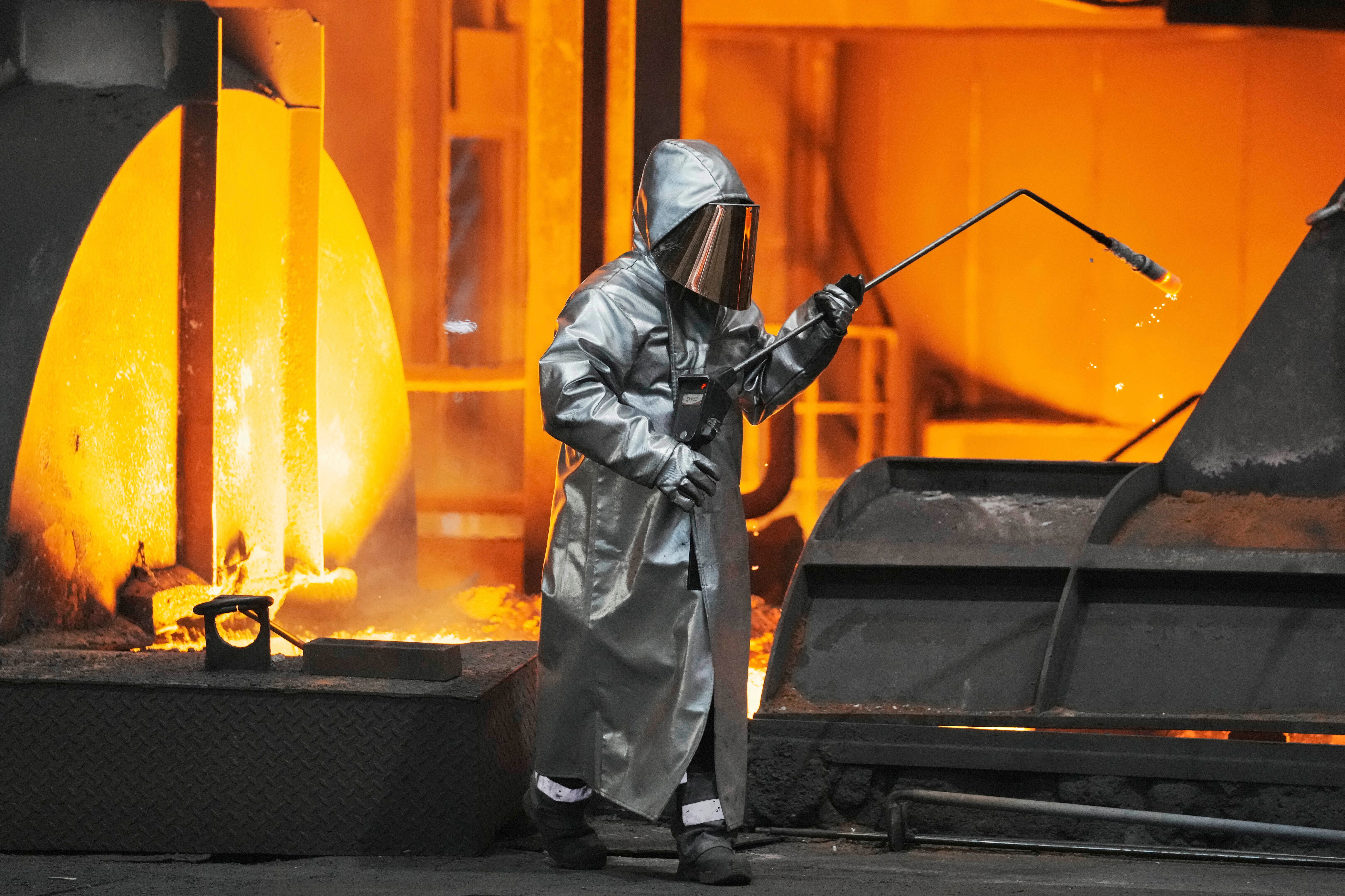 A steel worker is seen during a visit of EU Commissioner for Prosperity and Industrial Strategy Stephane Sejourne at the Thyssenkrupp steelworks in Duisburg, Germany, after the EU Steel Action plan was presented, Thursday, March 20, 2025.