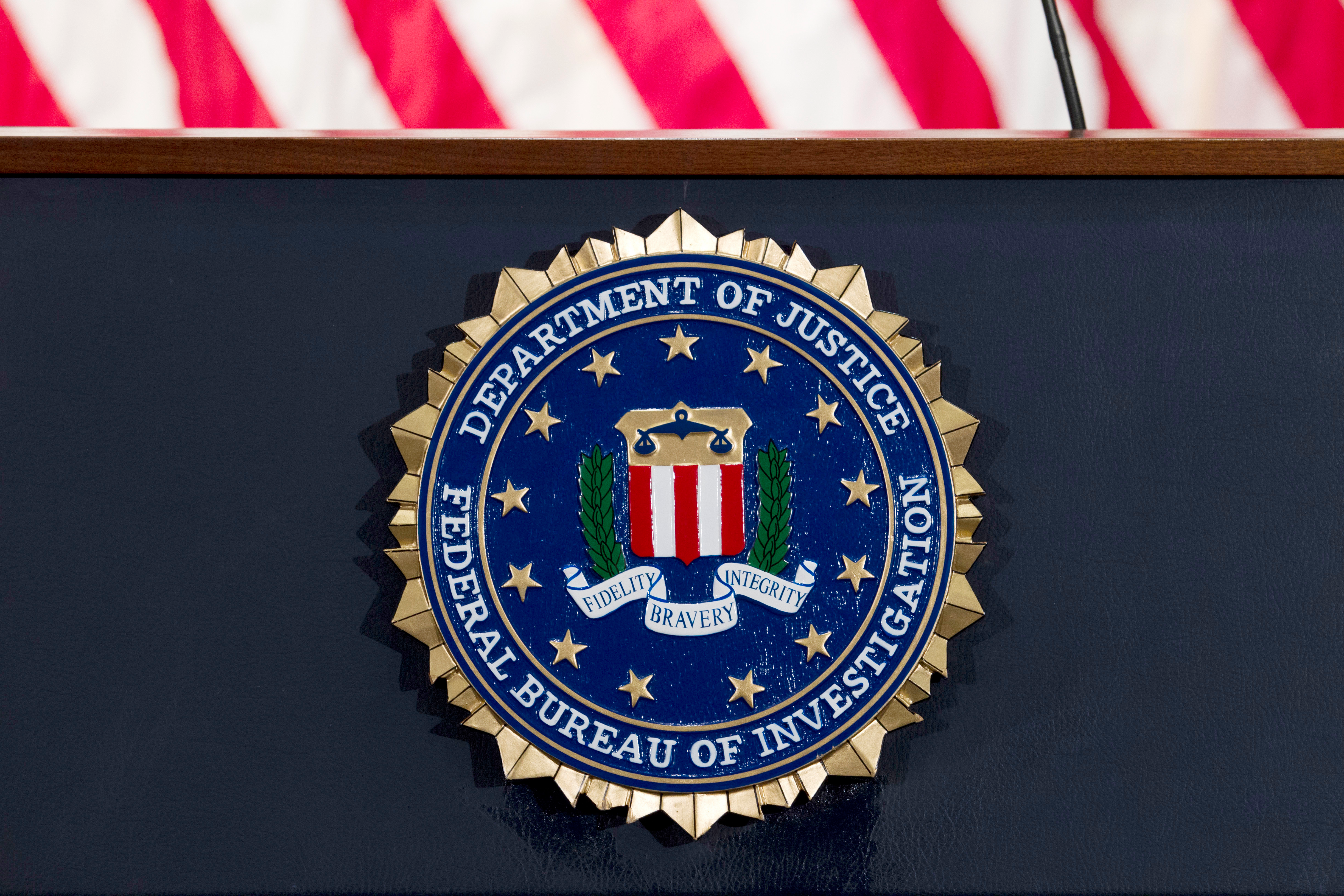 This June 14, 2018 file photo shows an FBI seal on a podium before a news conference at the agency's headquarters in Washington.