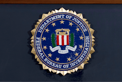 This June 14, 2018 file photo shows an FBI seal on a podium before a news conference at the agency's headquarters in Washington.
