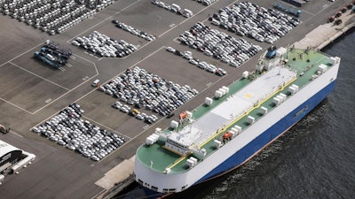 This photo shows vehicles bound for foreign countries at a logistics center in Kawasaki near Tokyo, Thursday, March 27, 2025.