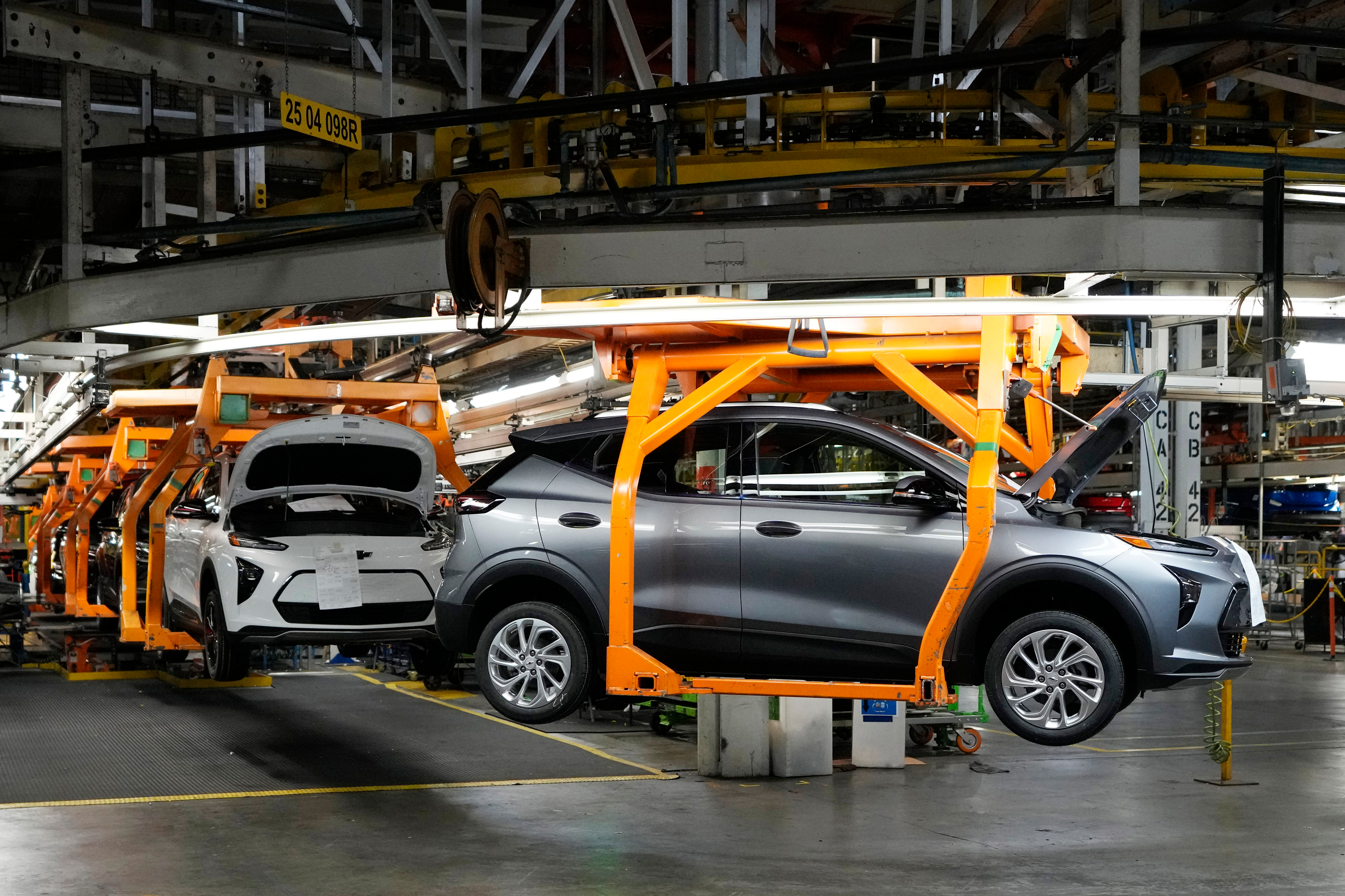 Vehicles move along the 2023 Chevrolet Bolt EV and EUV assembly line at the General Motors Orion Assembly on June 15, 2023, in Lake Orion, Mich.