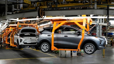 Vehicles move along the 2023 Chevrolet Bolt EV and EUV assembly line at the General Motors Orion Assembly on June 15, 2023, in Lake Orion, Mich.