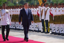 Chinese President Xi Jinping inspects honor guards during the official welcoming ceremony at the national palace in Kuala Lumpur, Malaysia, Wednesday, April 16, 2025.