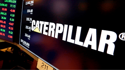 The logo for Caterpillar appears above a trading post on the floor of the New York Stock Exchange, April 23, 2018.