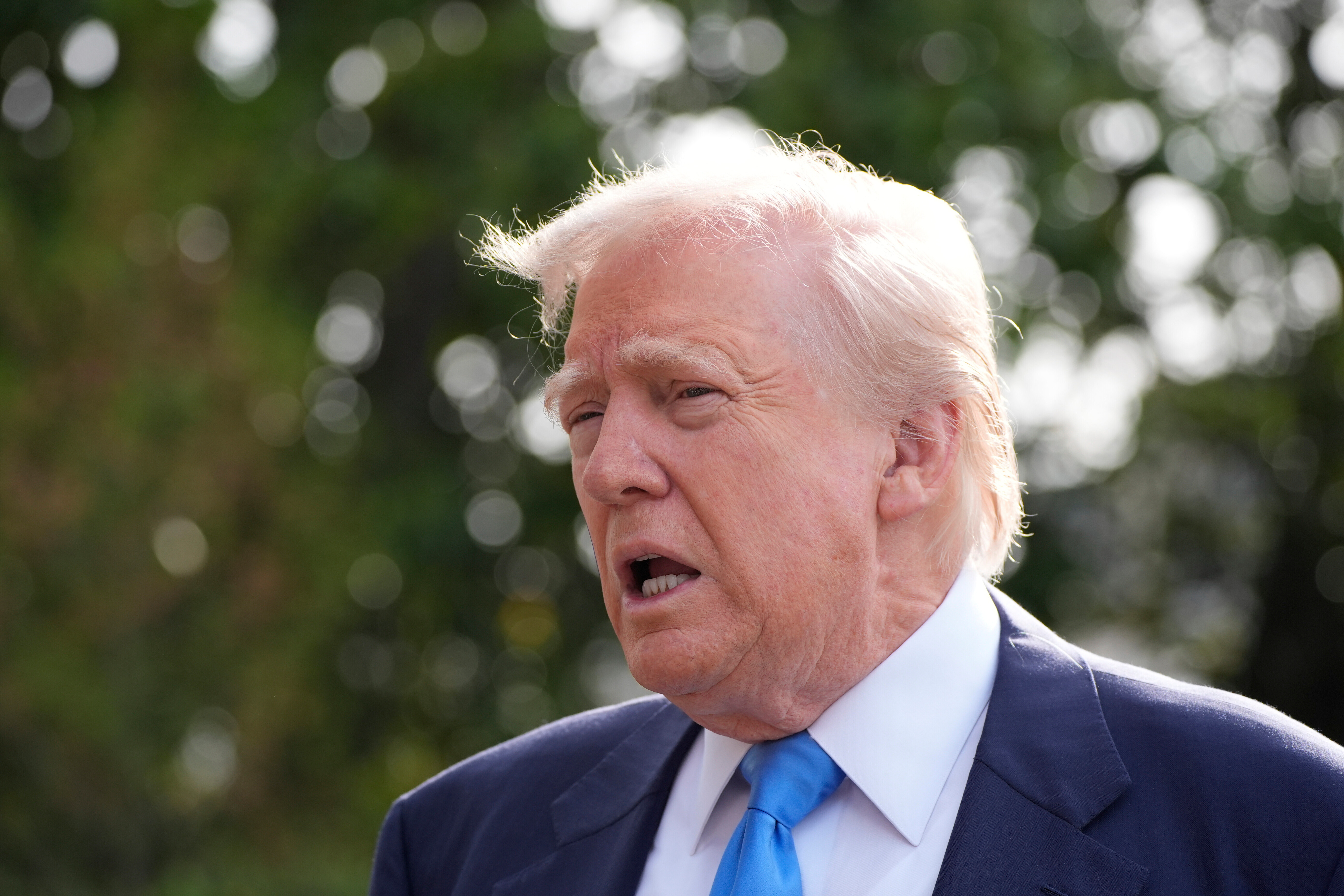 President Donald Trump speaks with reporters as he and first lady Melania Trump depart on Marine One from the South Lawn of the White House, Friday, April 25, 2025, in Washington.