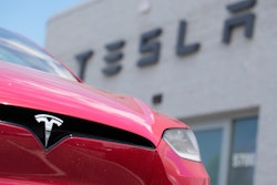 A Model X sports-utility vehicle sits outside a Tesla store in Littleton, Colo., June 18, 2023.