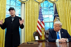 President Donald Trump listens as Elon Musk speaks in the Oval Office at the White House, Feb. 11, 2025, in Washington.