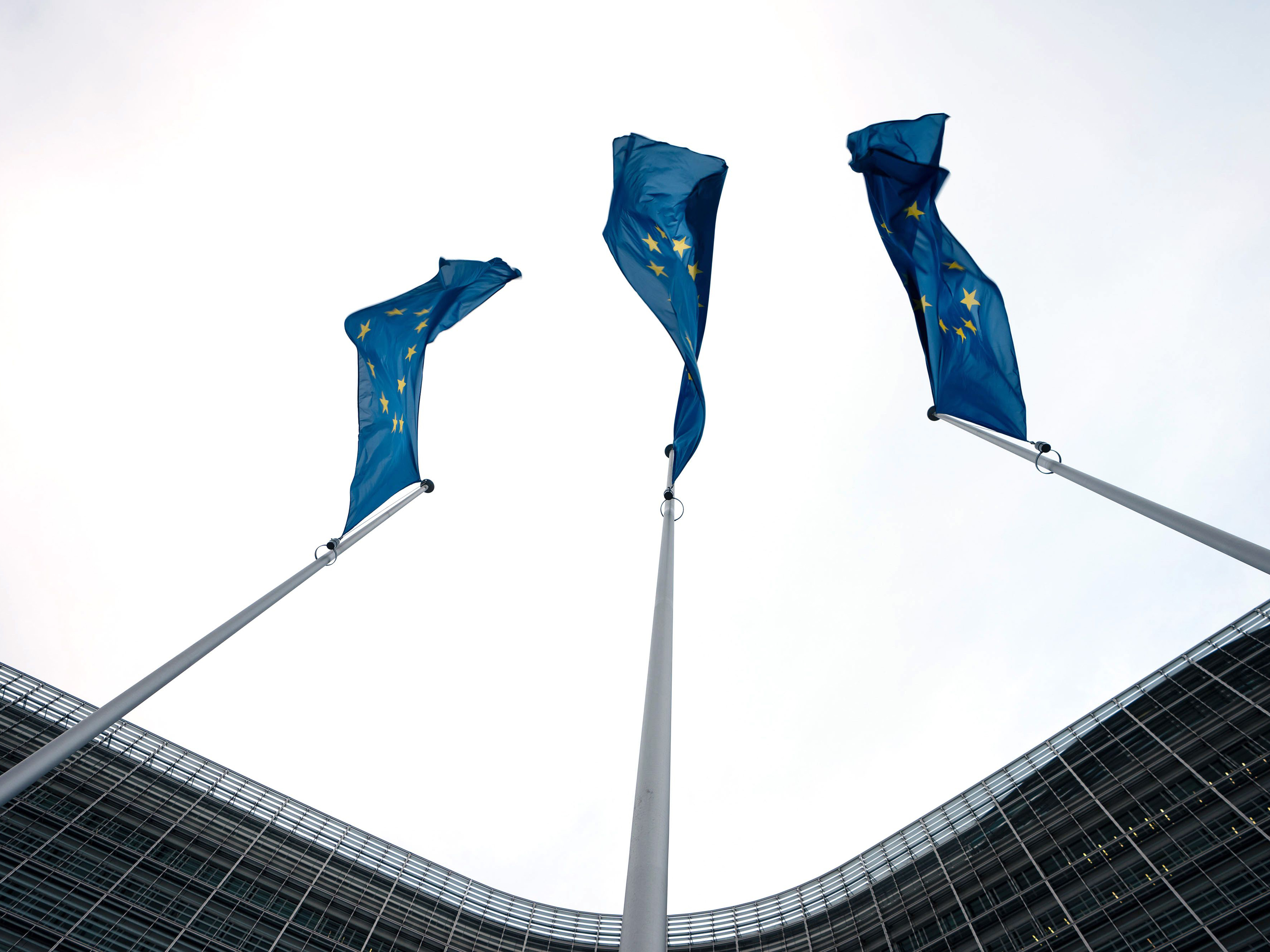 EU flags wave outside the headquarters of the European Commission in Brussels, Belgium. Photo: Bloomberg.