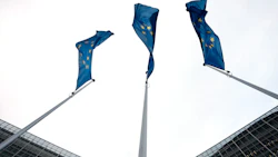 EU flags wave outside the headquarters of the European Commission in Brussels, Belgium. Photo: Bloomberg.