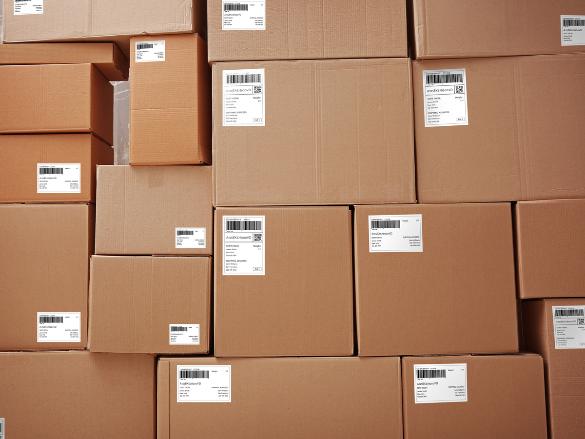 Parcels with tracking codes are stacked. Photo: Leonid Iastremskyi/ Alamy.