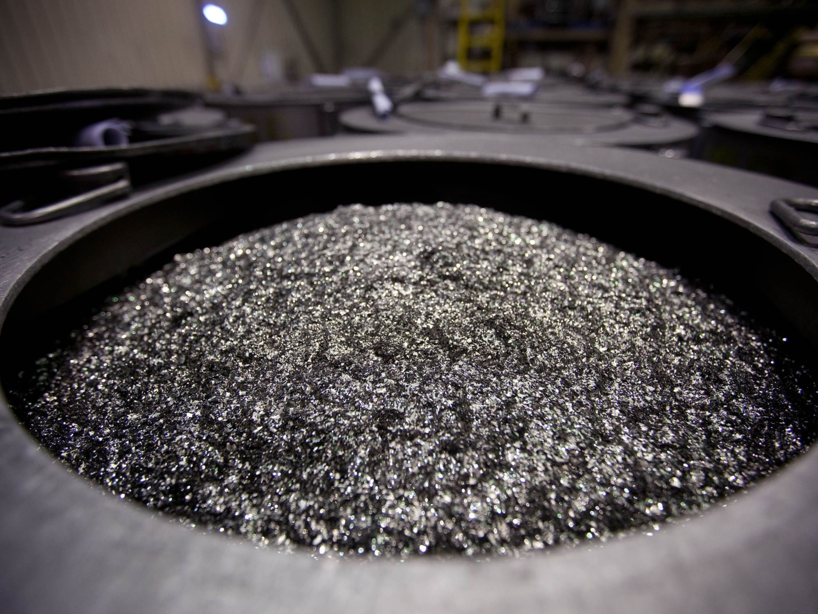 Annealed neodymium iron boron magnets sit in a barrel prior to being crushed into powder. One of several rare earth elements, neodymium is critical to the motors used in electric vehicles. Photo: Bloomberg.