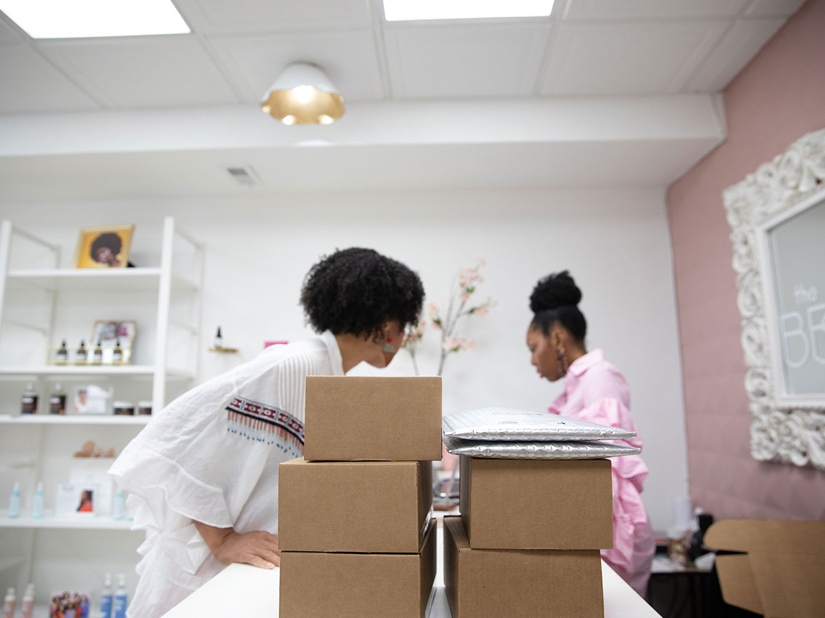 Kimberly Smith, right, and Amaya Smith prepare orders at Brown Beauty Co-Op. Photo: Bloomberg