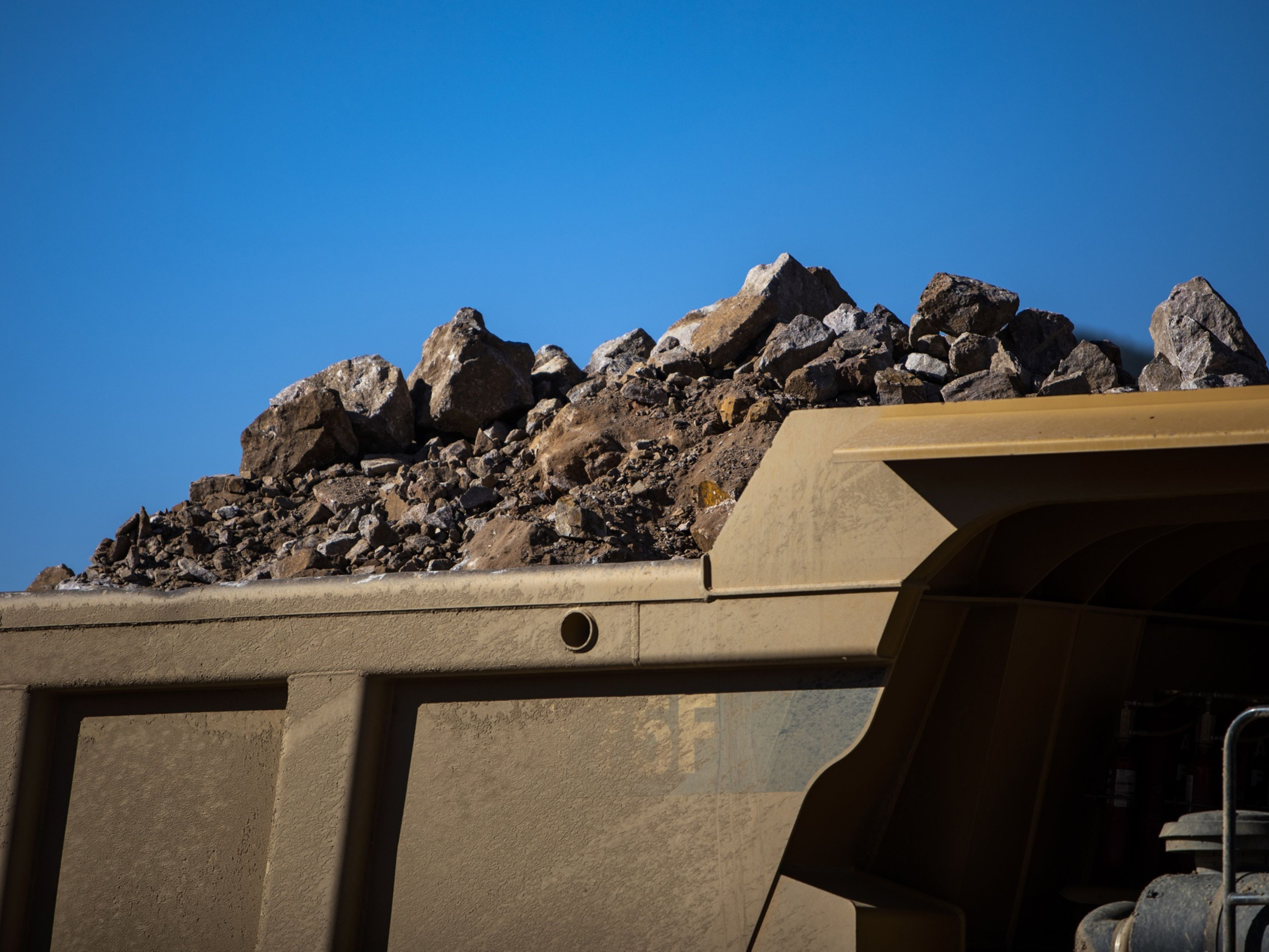 A truck with raw ore at open-pit mine in California. Photo: Bloomberg.