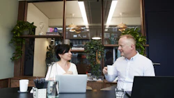 Two colleagues meet in a conference room. Photo: Pexels.
