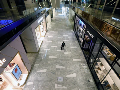 A shopper walks through Hudson Yards mall in New York. Photo: Bloomberg.