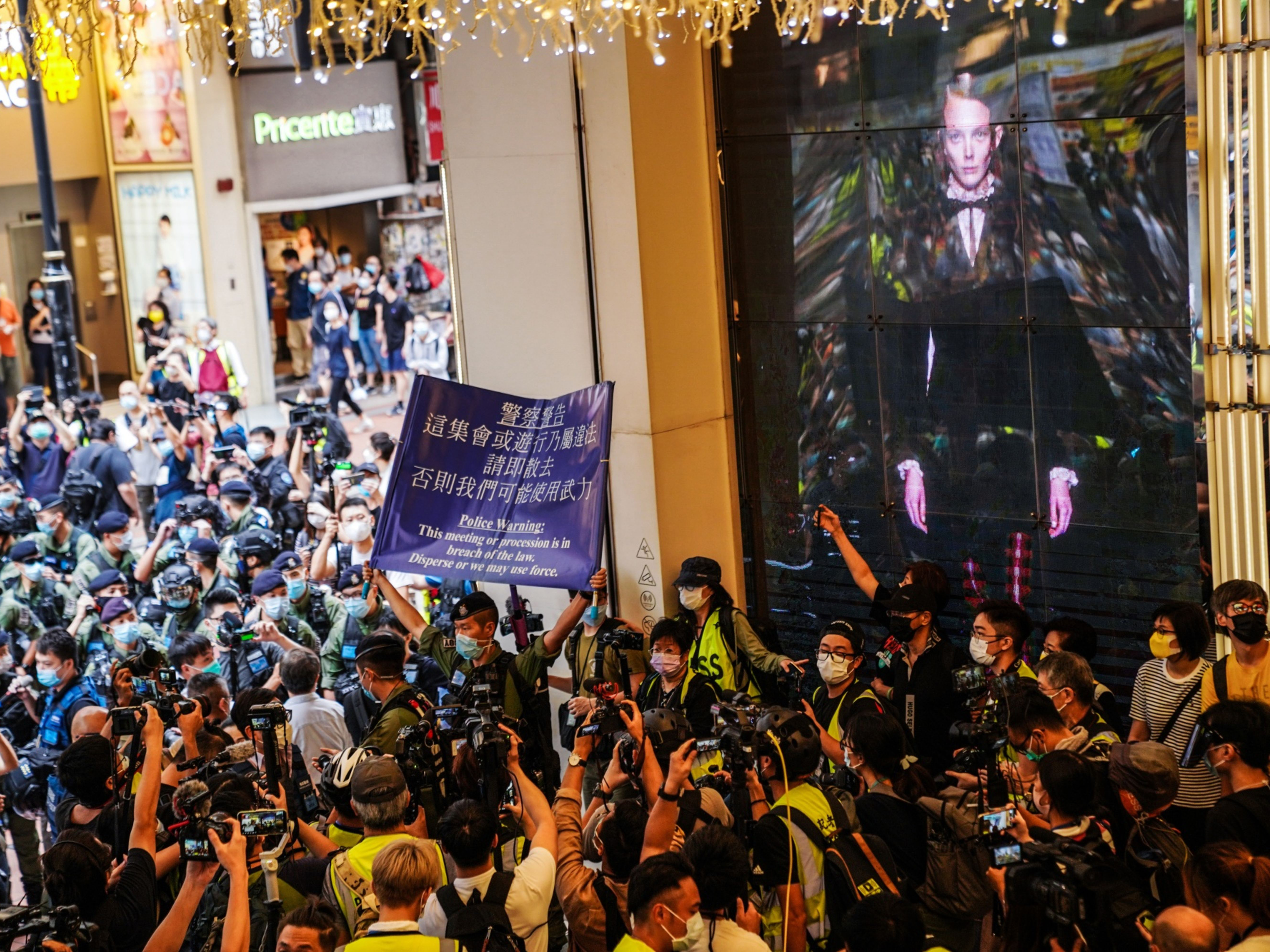 Riot police warn people to disperse during a protest in Hong Kong, China. Photo: Bloomberg.