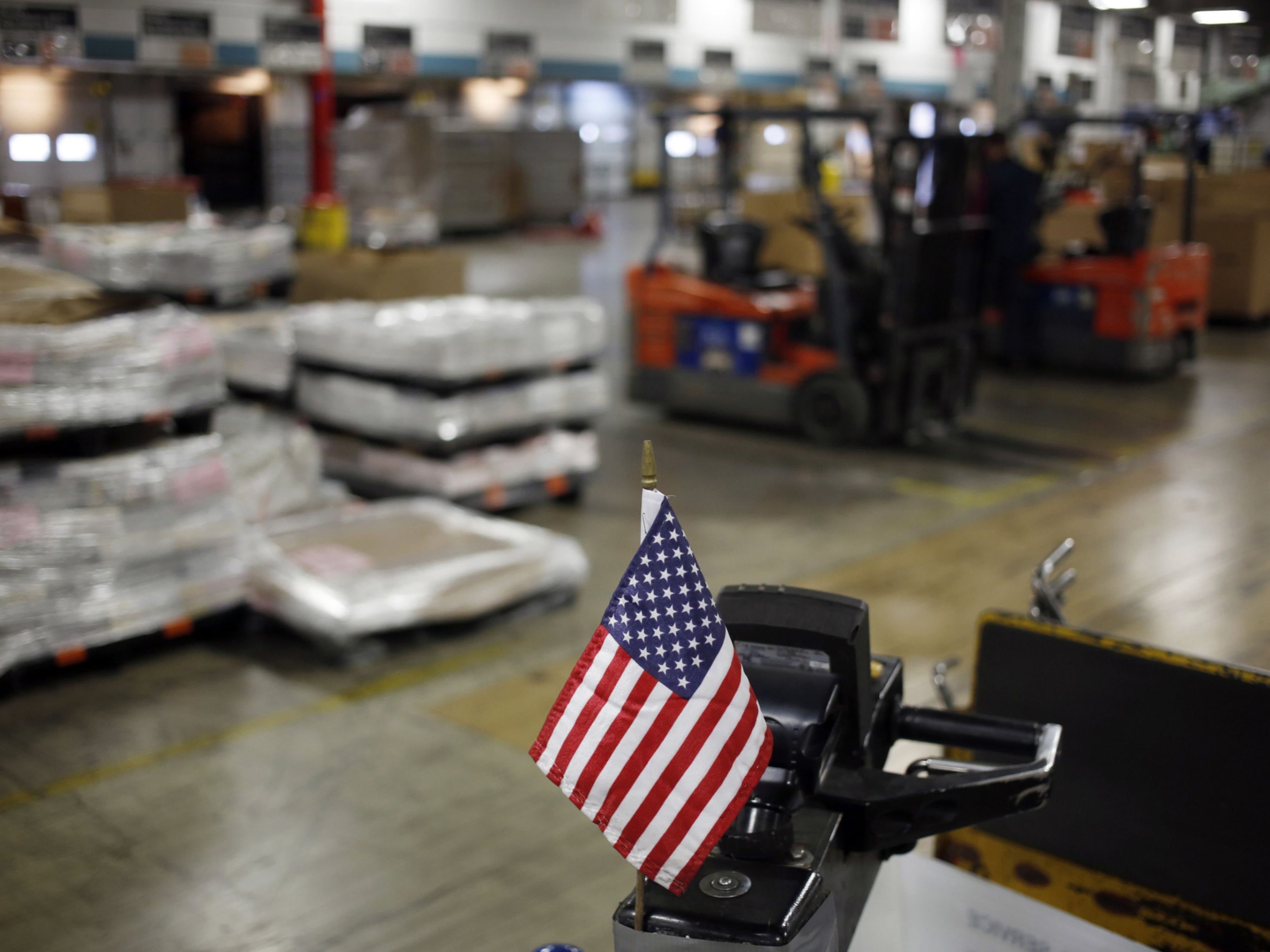 An American flag is displayed on a loading dock. Photo: Bloomberg.
