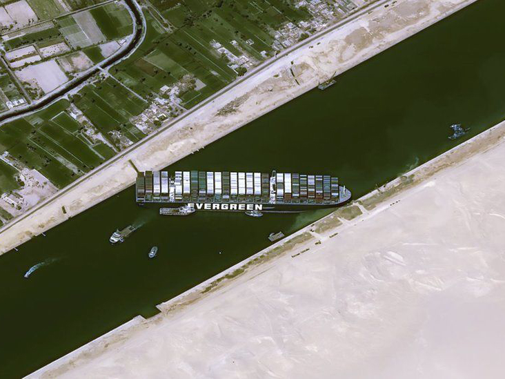Satellite image from Cnes2021, Distribution Airbus DS, shows cargo ship Ever Given stuck in the Suez Canal near Suez, Egypt, Thursday, March 25, 2021.