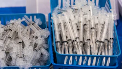 Baskets of syringes at a COVID-19 vaccination site. Photo: Bloomberg.