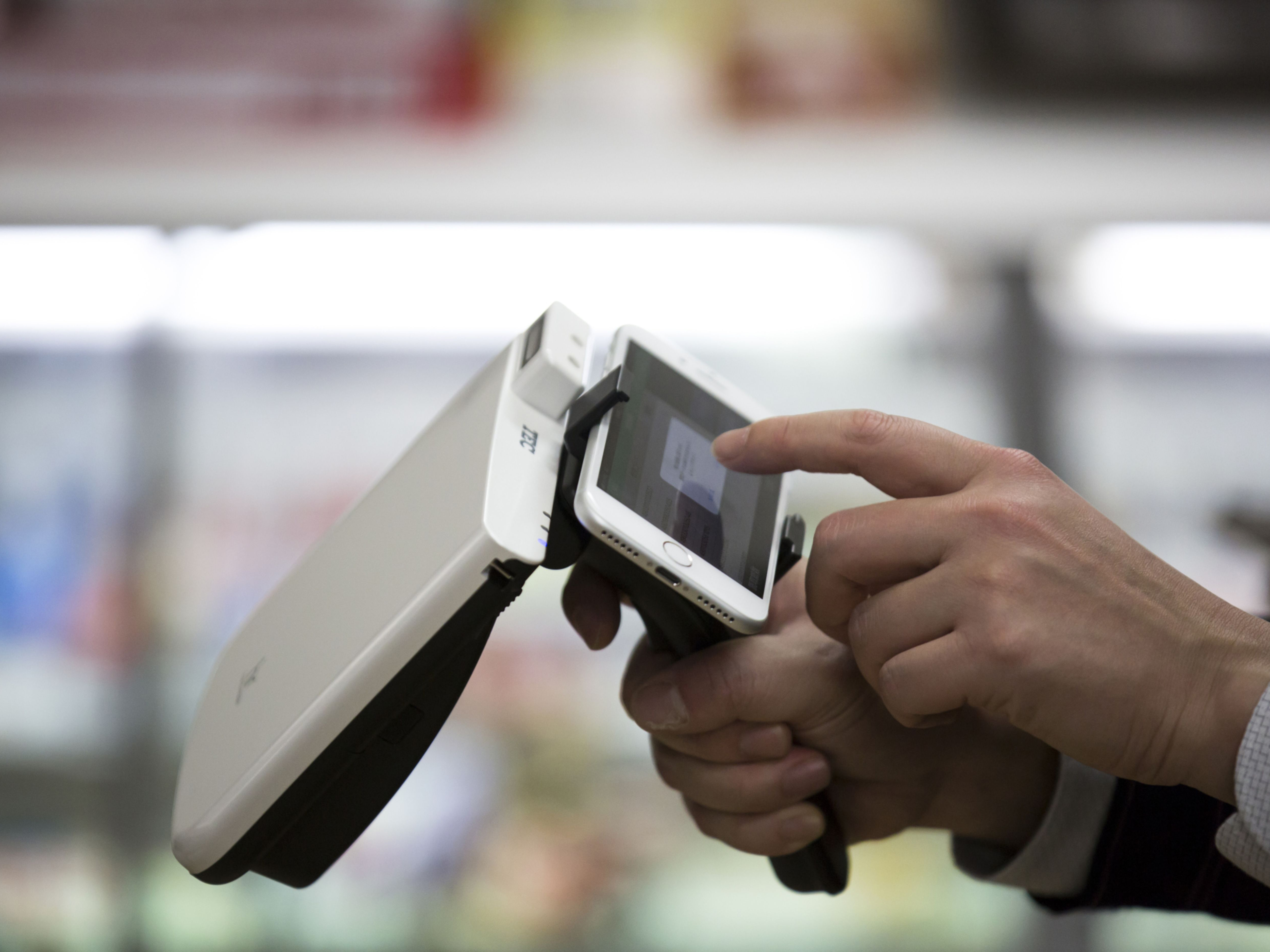 A radio-frequency identification (RFID) reader operated with a smartphone. Photo: Bloomberg.