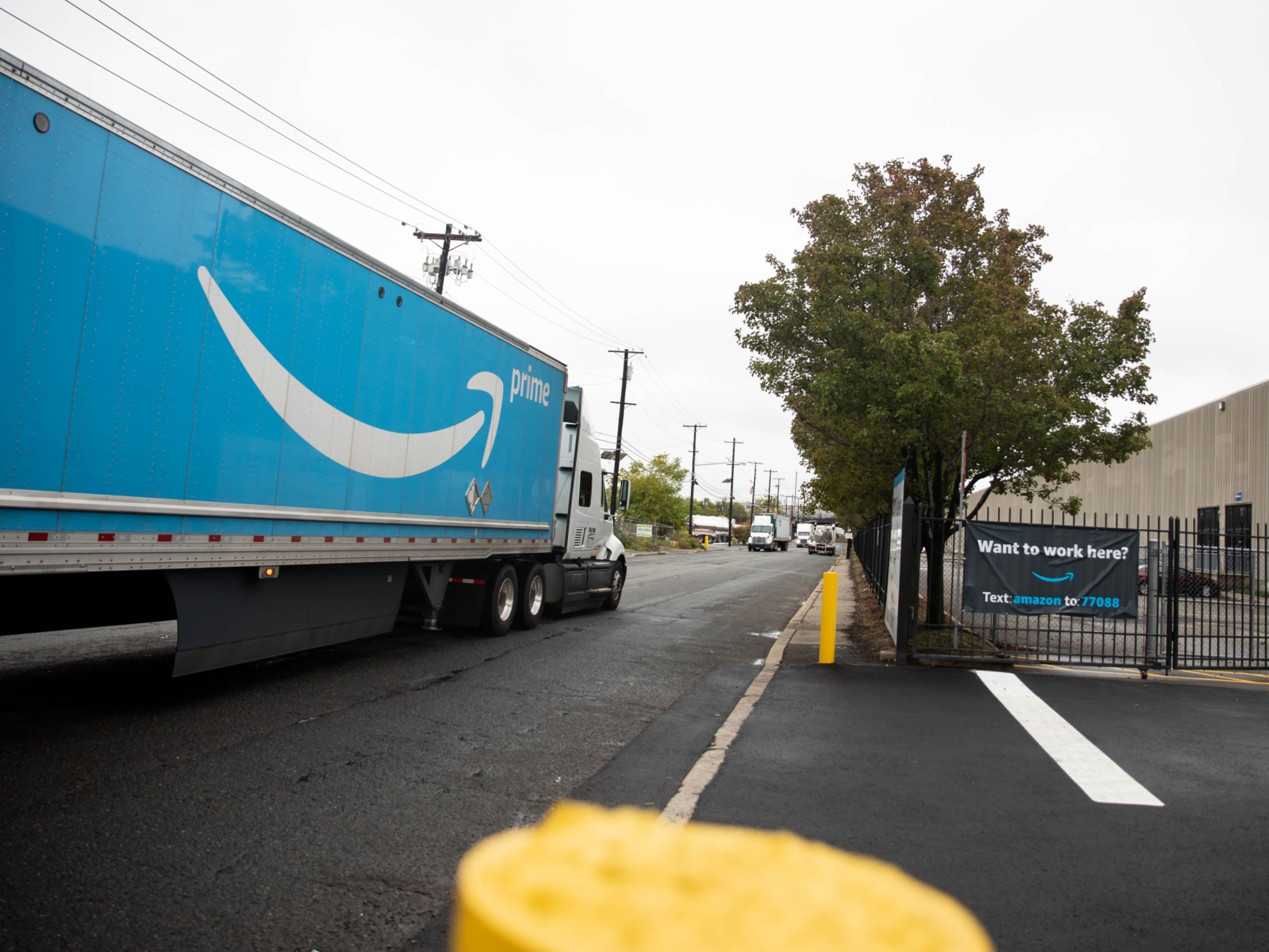 A truck drives through an Amazon delivery station in Kearny, New Jersey. Photo: Bloomberg.