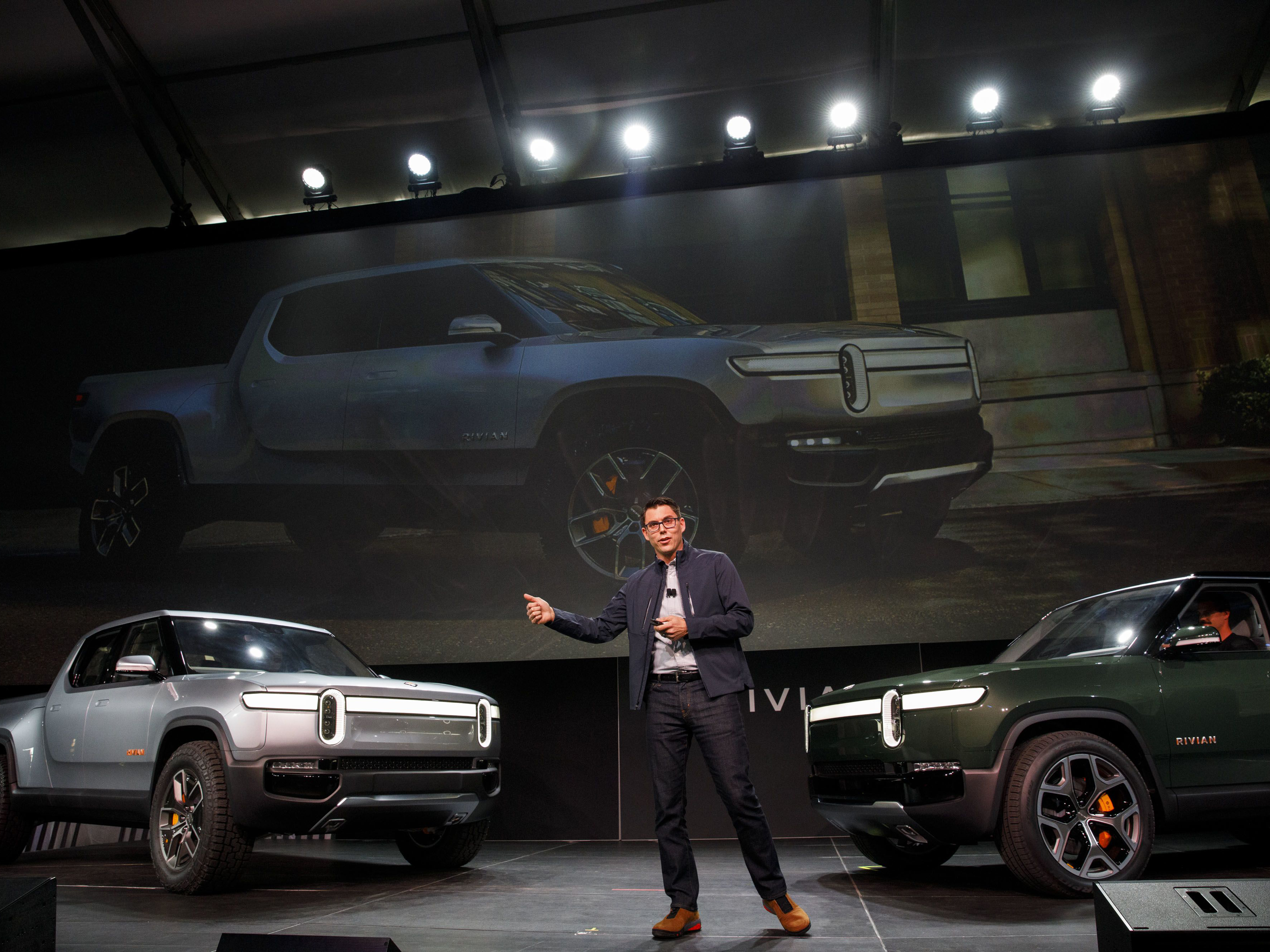 Rivian founder R.J. Scaringe unveils the R1T, left, and R1S in 2018. Photo: Bloomberg.