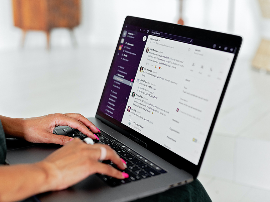 An employee messages colleagues via Slack, a workplace communications app. Photo: Mikhail Nilov/ Pexels.