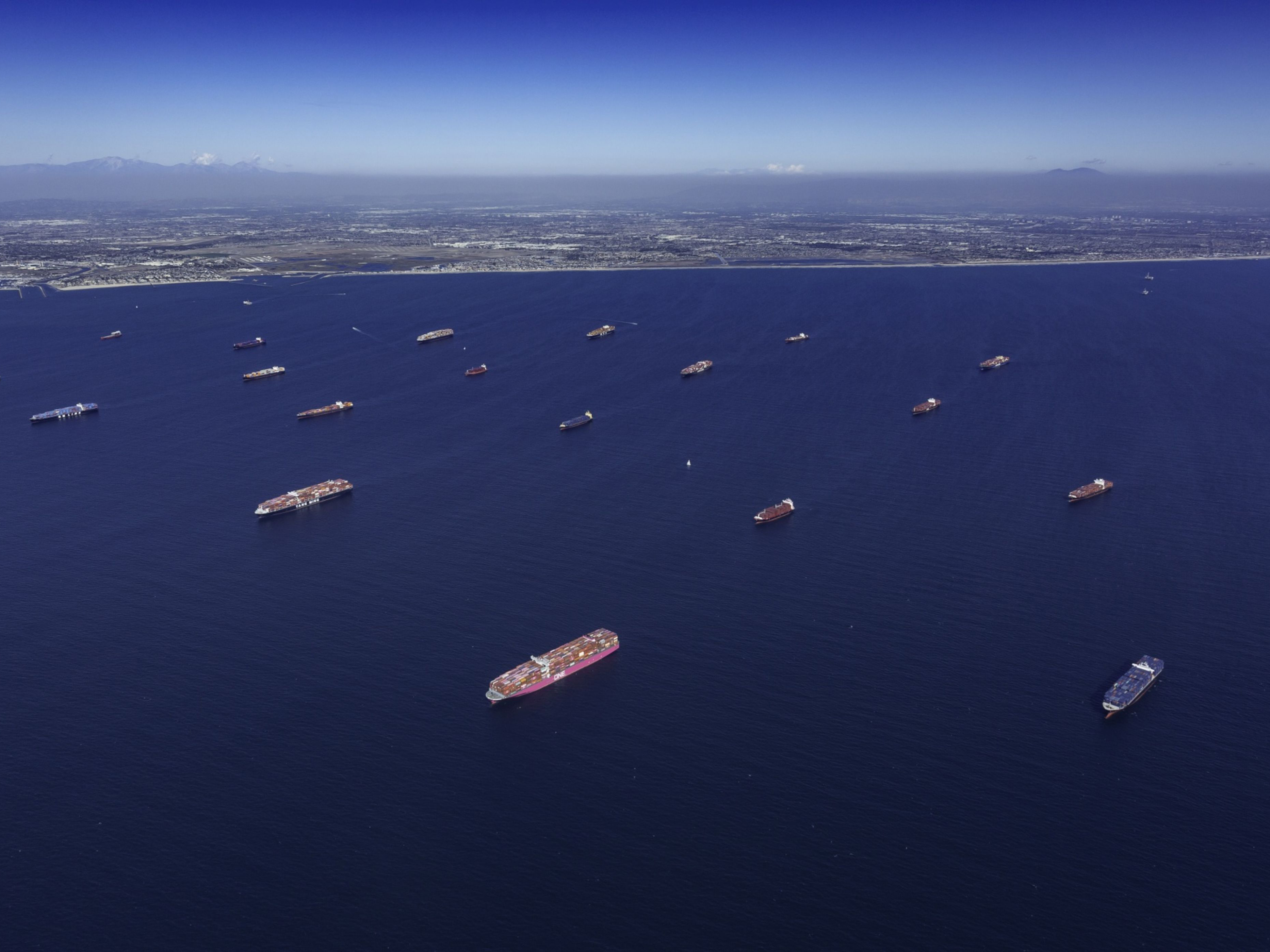 Container ships moored off the Los Angeles and Long Beach ports in Long Beach, California. Photo: Bloomberg.