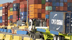 A truck carries a shipping container at the Georgia Port Authority Mason Mega Rail Terminal in Garden City, Georgia. Photo: Bloomberg.