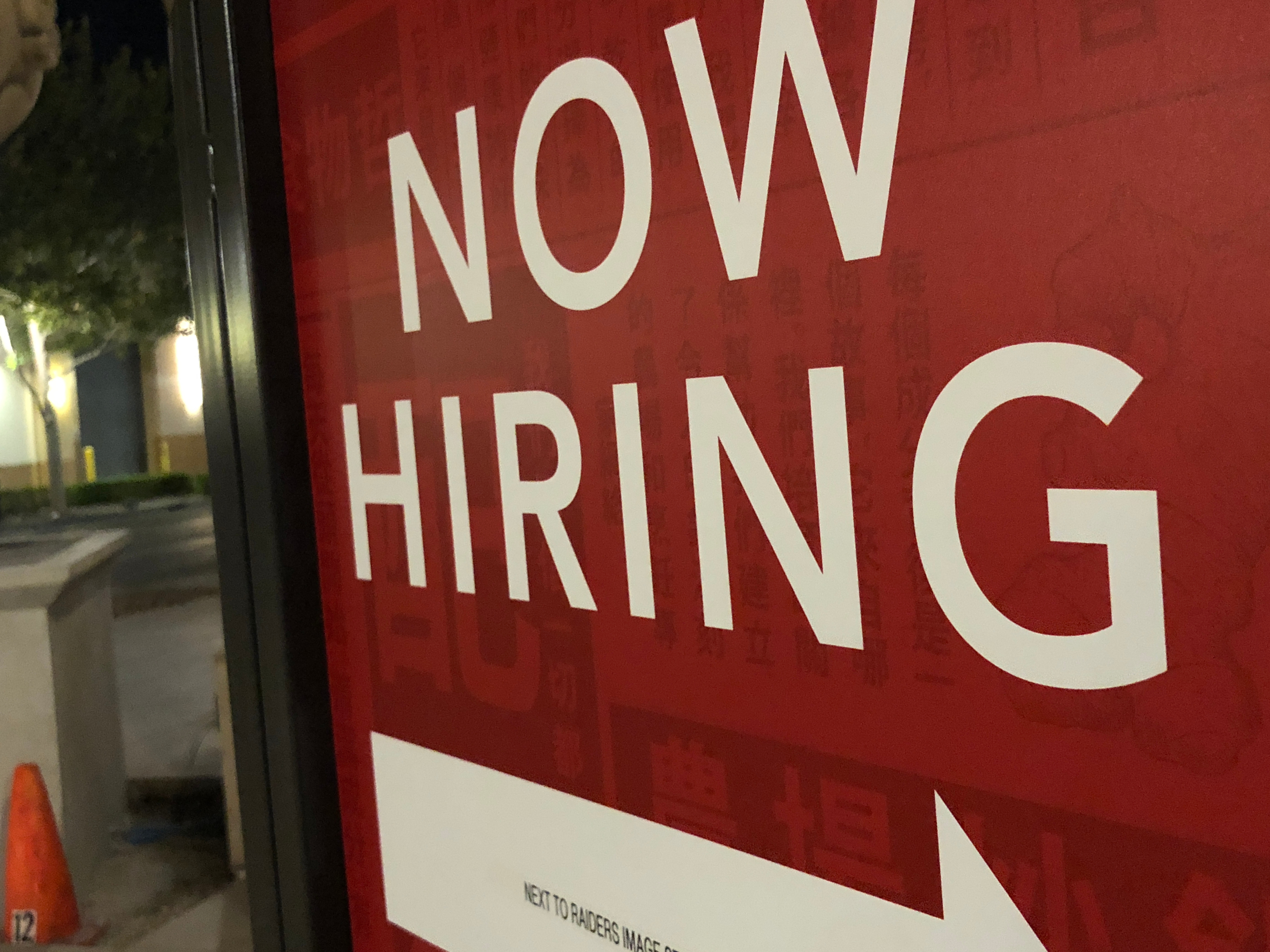 A sign reads 'Now Hiring.' Photo: Getty Images.