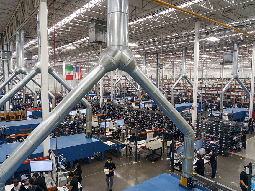 At the TSC Miami factory in Juarez, Mexico, workers design and print T-shirts. Photo: Bloomberg.