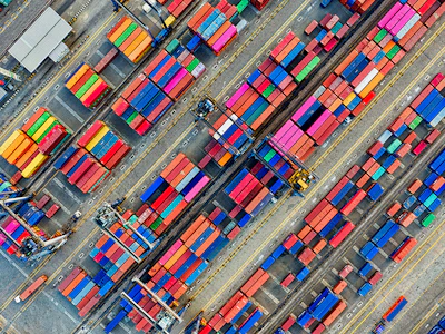 Containers stacked at a shipping terminal. Photo: Tom Fisk/ Pexels.